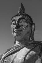 Stone Buddha statue, historic Buddhist temple complex, black and white photo, Ayutthaya, Thailand