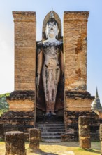 Stone Buddha statue in the historic Wat Mahathat Buddhist temple complex, historical park,