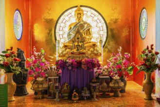 Shrine with gilded Buddhist statue in the main pagoda, Buddhist temple complex Wat Phra That Sorn