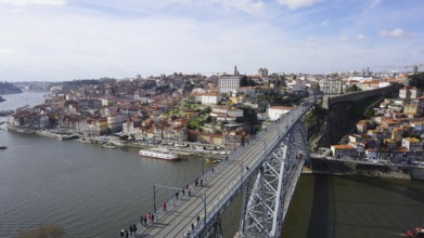 View from above of the metal bridge Ponte dom Luis across the Douro in Porto of a city with bridge