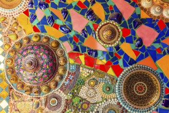 Wall covering with colorful mosaic tiles and incorporated bowls, Buddhist temple complex Wat Phra