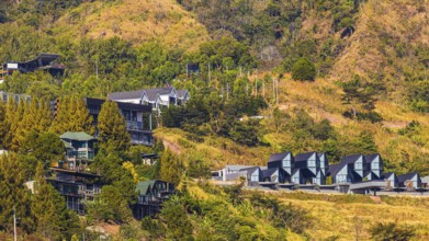 Residential complex with modern residential buildings, behind the Wat Phra That Sorn Kaew Buddhist