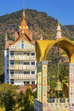 Bell tower decorated with mosaic and glass works of art, Buddhist temple complex Wat Phra That Sorn