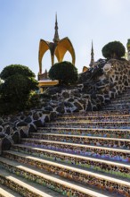 Staircase decorated with colorful mosaic tiles, Buddhist temple complex Wat Phra That Sorn Kaew,