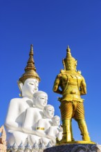 Five-headed Buddha statue with a gilded temple guard in front of it, Wat Phra That Sorn Kaew