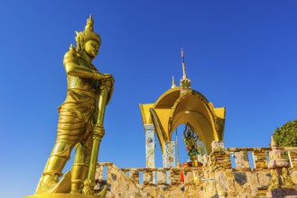 Round arch pavilions decorated with colorful mosaics and glass works of art, in front of a gilded