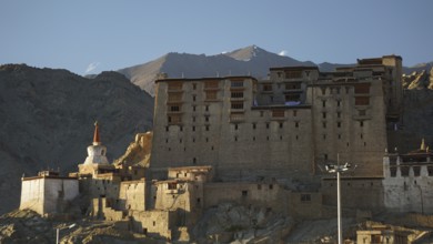 Leh Palace in mountainous landscape during twilight, Leh, trekking in Ladakh, Himalayas, India