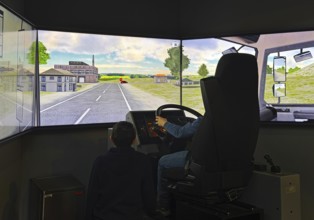 Truck simulator with children at DASA, German Occupational Safety Exhibition, Dortmund, Ruhr area,