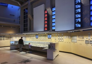 Father with his two small children in the huge energy hall of DASA, German Occupational Safety