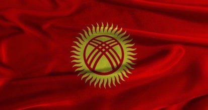 Flag of Kyrgyzstan with fabric textured background. Close up of National flag of Kyrgyzstan with