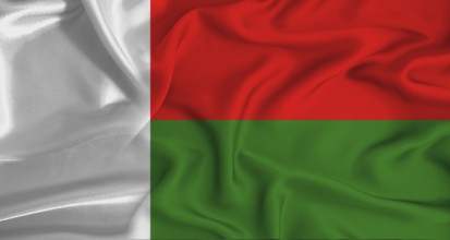 Realistic Madagascar flag waving. Close up of flag of Madagascar with cloth texture