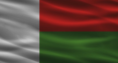 Malagasy flag with fabric texture. Realistic flag of Madagascar waving
