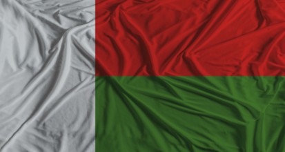 Madagascar flag with fabric texture background. National flag of Madagascar with cloth texture