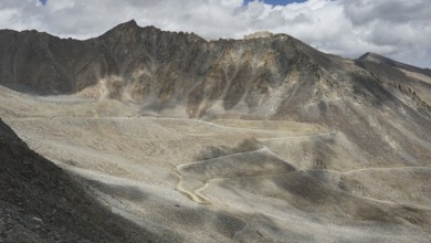Close view of a winding road through a rocky mountain landscape, trekking in Ladakh, Himalayas,