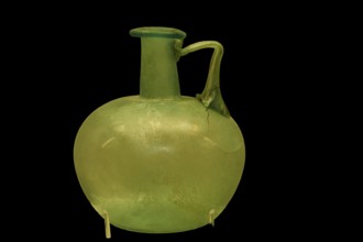 Ancient green glass vase with round body and narrow handle, Olympia Archaeological Museum, Ancient