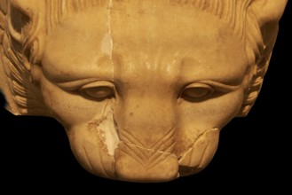 Close-up of a stone lion's head, showing ancient craftsmanship, Olympia Archaeological Museum,