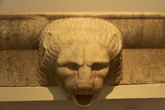 Stone lion head in ancient architectural style as a decorative element, Olympia Archaeological