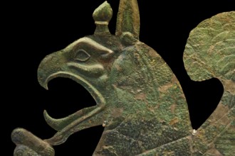 Section of a monumental bronze sheet, griffin, complex bronze sculpture of a mythological being