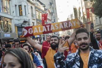 Istanbul, Turkey. November 11th 2021 A smiling Turkish Galatasary football fan holding a supporters