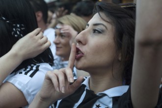 Istanbul, Turkey, May 8th 2016 Female Besiktas Carsi football supporters singing songs before a