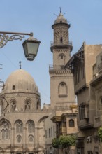 The iconic domes and minarets of the historical buildings in Islamic Cairo along Muiz street near