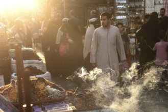 Cairo, Egypt. July 2nd 2024 Smoke from burning incense in a busy market in the historical Islamic