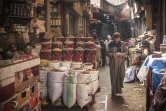 Cairo, Egypt. July 1st 2024 An Egyptian man walking in the narrow streets of the spice market a