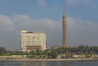 Cairo, Egypt. July 1st 2024 The Cairo Tower and Novotel in El Gezira Street, Zamalek, Cairo, beside
