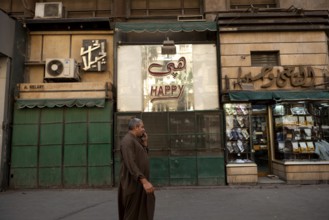 Cairo, Egypt. June 14th 2024 Typical Downtown Cairo street scene as an Egyptian man walks past