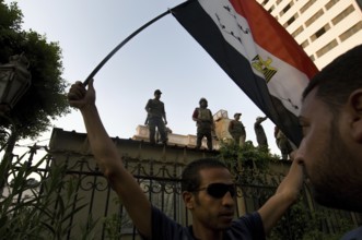 Cairo, Egypt. July 12th 2011 Protestors and armed guards outside the Shura Caouncil building,