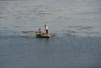 Al Qanatir Al Khayriyyah, Egypt. December 18th 2022 Fishermen on a small boat on the Nile River nr