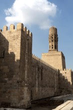 Cairo, Egypt, November 26th 2022 Minaret of the Al Hakim Mosque with the fortified defensive