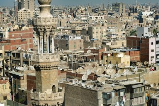 Cairo, Egypt. November 29th 2022 Mosque minaret in front of crowded aerial cityscape view of Cairo,