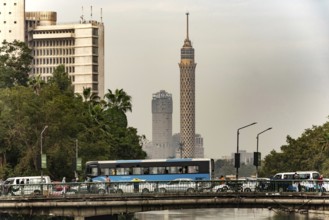 Cairo, Egypt, November 26th 2022 Egyptian commuter bus in traffic on a road bridge over the River