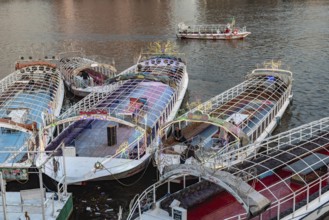 Cairo, Egypt. November 26th 2022 Egyptian pleasure cruise boats and ferry moored beside Qasr El Nil