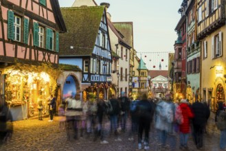 Christmassy decorated half-timbered houses, Christmas market, Riquewihr, Grand Est, Haut-Rhin,