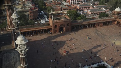 View from above of the Jama Masjid Historic Mosque in an urban setting with people and