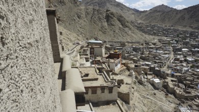 City view from Leh Palace over Leh with mountains and cloudy sky, Ladakh, North India, Himalayas,