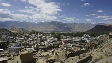 Panoramic view of Leh city with surrounding mountains and slightly cloudy sky, Ladakh, North India,
