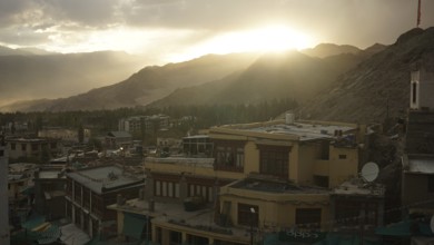 Sunset over Leh with houses and mountains in twilight, Leh, Ladakh, North India, Himalayas, India
