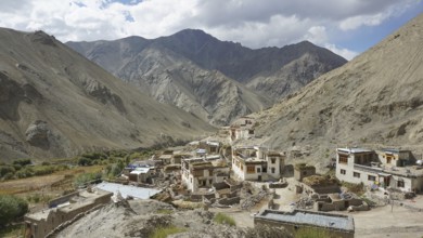 Traditional village in a mountain valley surrounded by magnificent mountains, trekking in Ladakh,