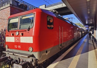 Locomotive with commuter train on the railway track, Gesundbrunnen station, Berlin, Germany