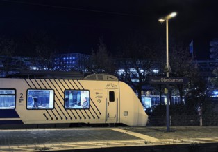 Local train at Oberbamen station at night, Wuppertal, North Rhine-Westphalia, Germany