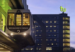 The H Bahn, an automatically controlled large cabin suspension railway in front of the Mathetower