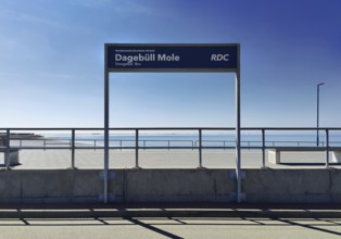 Dagebüll Mole sign of the Norddeutsche Eisenbahn Niebüll with a view of the North Sea,