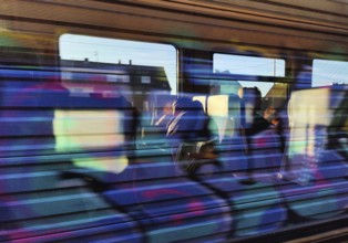View from the window and reflection on a moving regional train, Germany