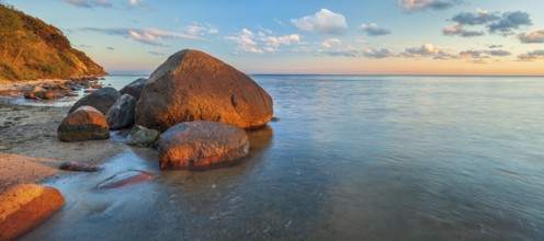 Coastal landscape with large boulders on the Baltic Sea beach in the evening light, Mönchgut Nature