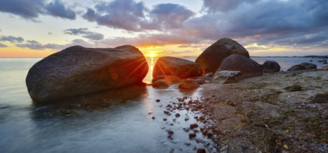 Large boulders on the Baltic Sea beach at sunset, Mönchgut Nature Reserve, Groß Zicker, Mönchgut