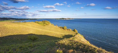 Hilly landscape in the Zicker Mountains, including Zicker Alps, view across the lagoon landscape to