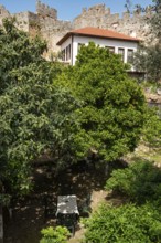 Alanya, Turkey. April 7th 2021 An empty table in a garden cafe inside the old castle walls of